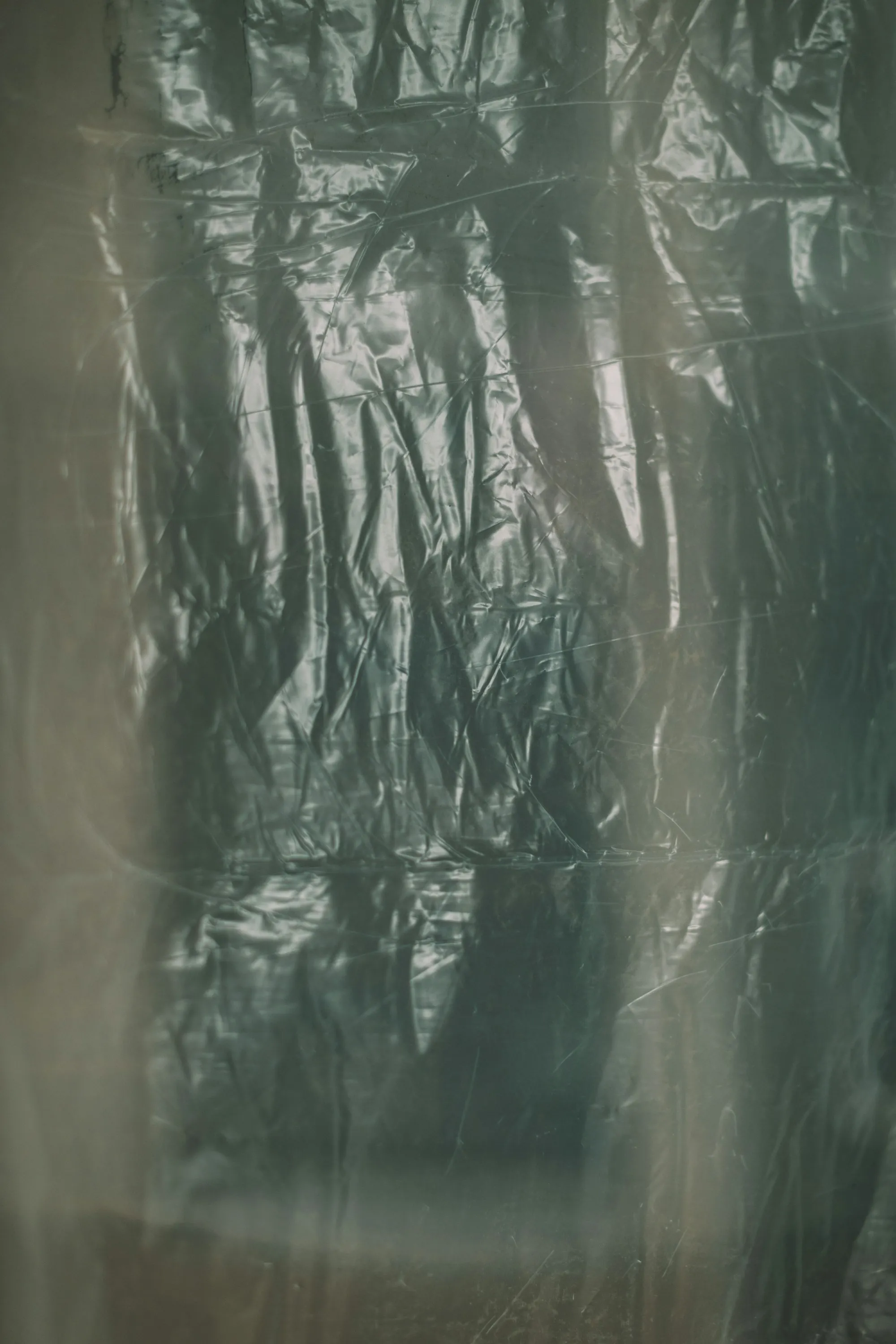 Clear plastic sheeting hanging in a sealed work area